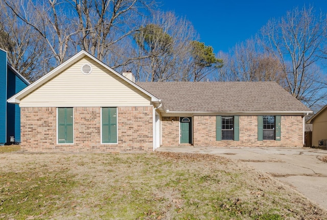 ranch-style home with a front yard and a patio