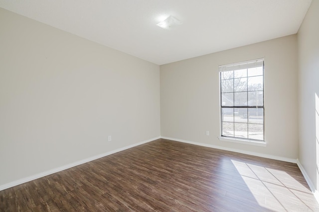 empty room with hardwood / wood-style flooring