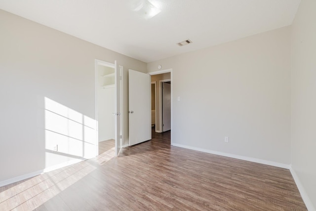 unfurnished room featuring wood-type flooring