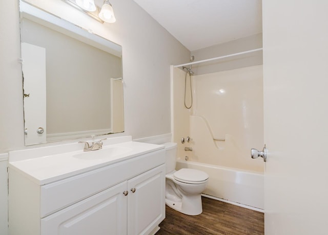 full bathroom featuring hardwood / wood-style floors, shower / tub combination, toilet, and vanity