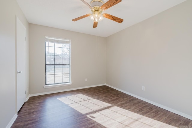 empty room featuring hardwood / wood-style flooring and ceiling fan