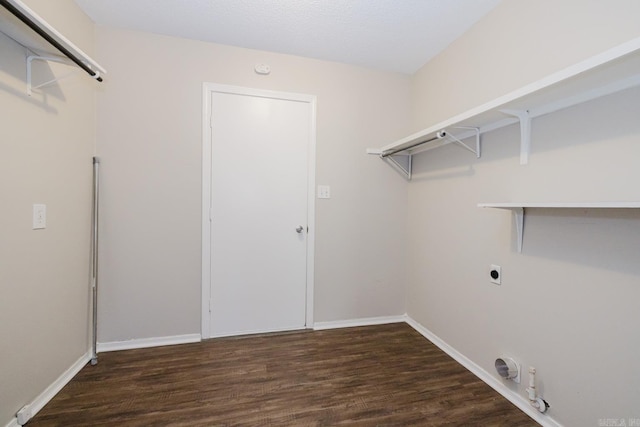 washroom with gas dryer hookup, hookup for an electric dryer, and dark hardwood / wood-style flooring