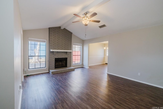 unfurnished living room with ceiling fan, a brick fireplace, vaulted ceiling with beams, and dark hardwood / wood-style flooring