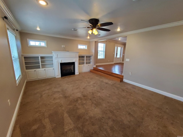 unfurnished living room featuring ceiling fan, crown molding, and carpet flooring