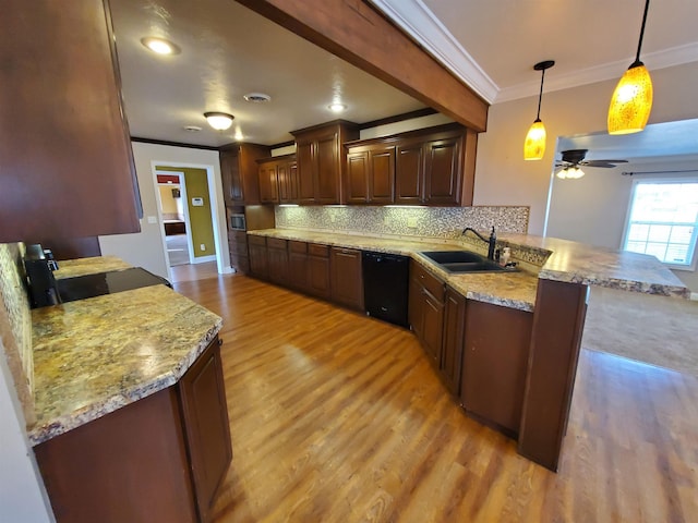 kitchen with dishwasher, decorative light fixtures, sink, kitchen peninsula, and light hardwood / wood-style flooring