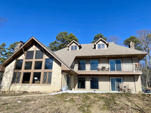 rear view of house with a balcony