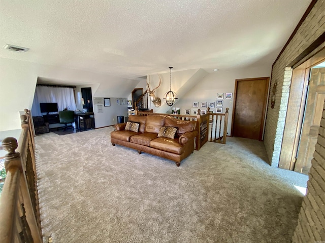 living room featuring carpet flooring, a textured ceiling, and vaulted ceiling