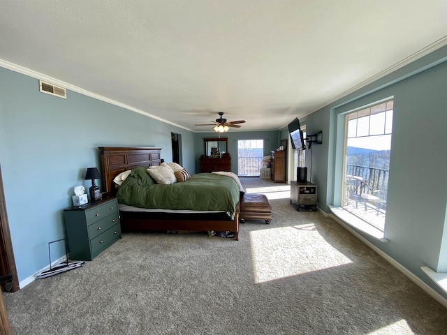 carpeted bedroom featuring crown molding, multiple windows, ceiling fan, and access to outside