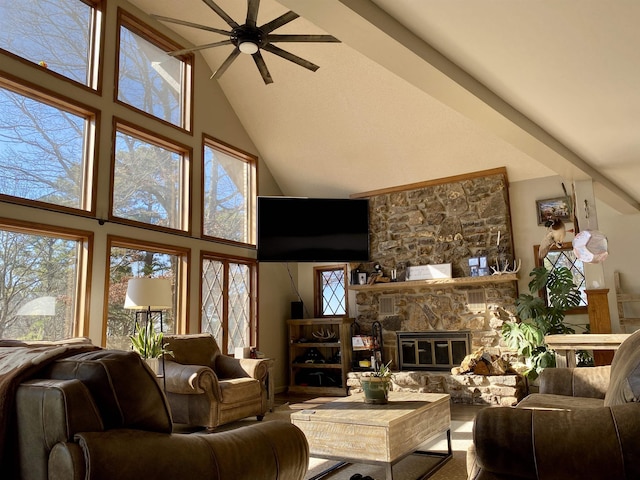 living room with high vaulted ceiling, ceiling fan, and a fireplace