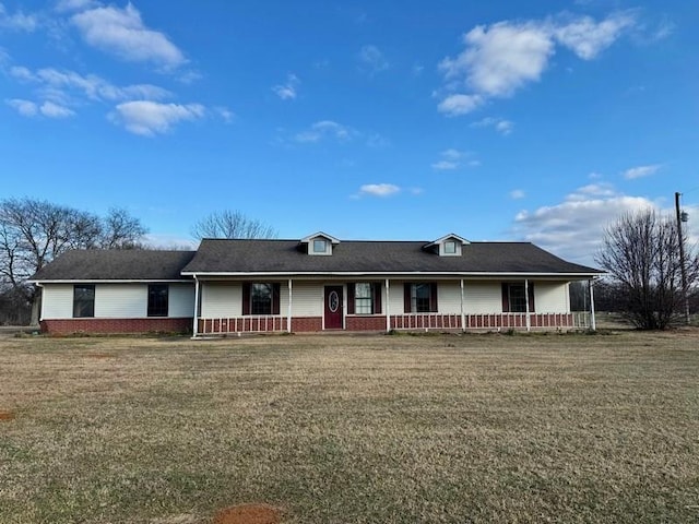 ranch-style house with a porch and a front lawn