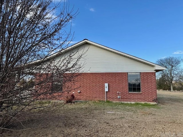 view of property exterior with a yard