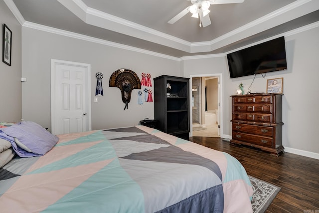 bedroom with ceiling fan, crown molding, ensuite bath, and a tray ceiling