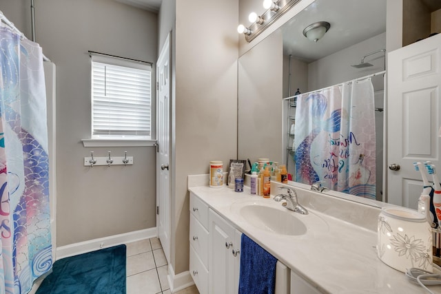 bathroom featuring tile patterned floors, vanity, and walk in shower