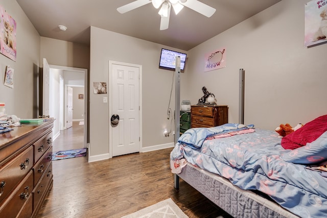 bedroom featuring ceiling fan and dark wood-type flooring