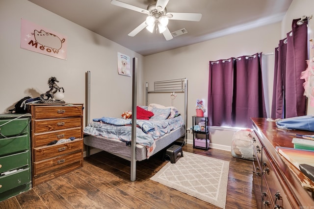 bedroom with ceiling fan and dark hardwood / wood-style flooring