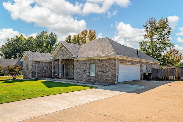 view of front facade featuring a garage and a front lawn