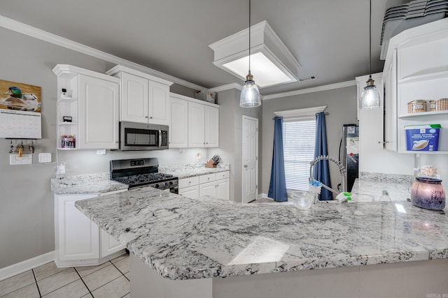 kitchen featuring kitchen peninsula, white cabinets, and stainless steel appliances