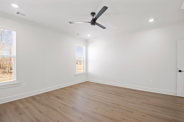 unfurnished room with ornamental molding, ceiling fan, and hardwood / wood-style floors