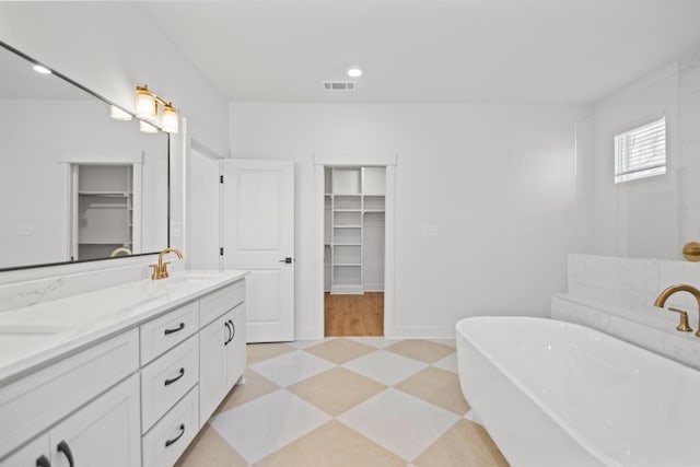 bathroom featuring vanity and a bathtub