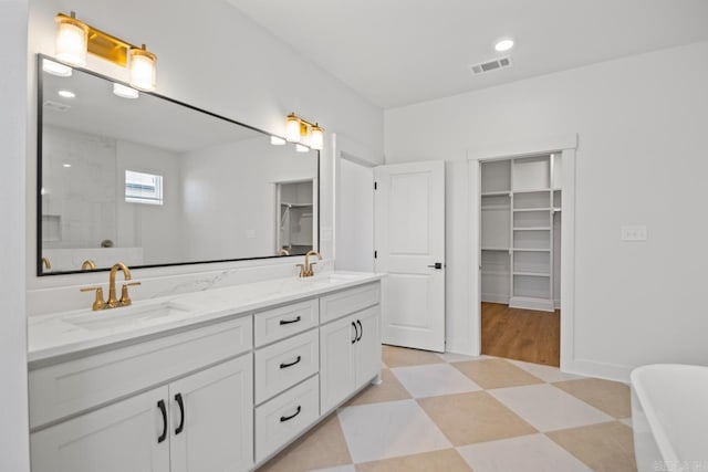 bathroom featuring vanity and plus walk in shower