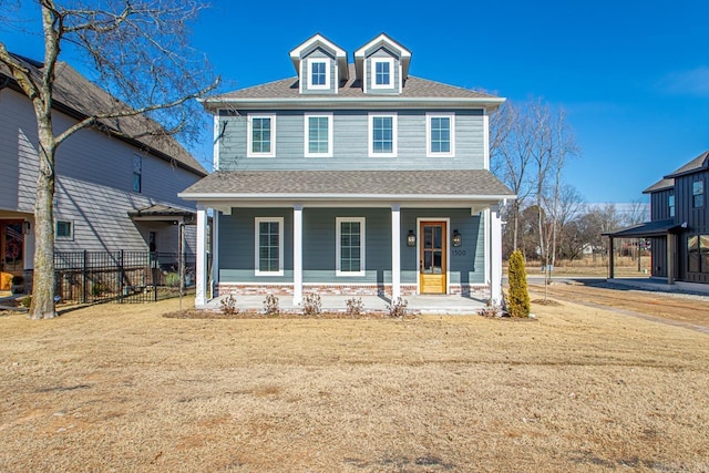 view of front of property with a front yard and a porch