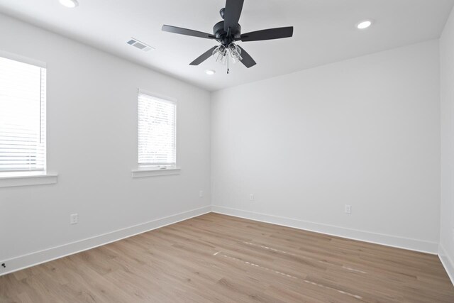 unfurnished room featuring light hardwood / wood-style floors and ceiling fan