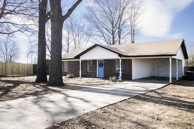 ranch-style home featuring a carport