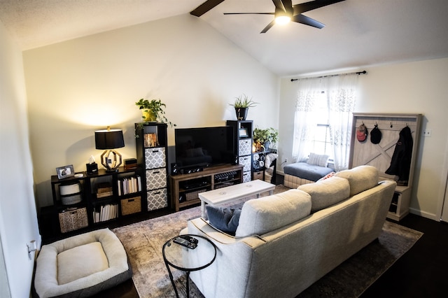 living room featuring ceiling fan and lofted ceiling