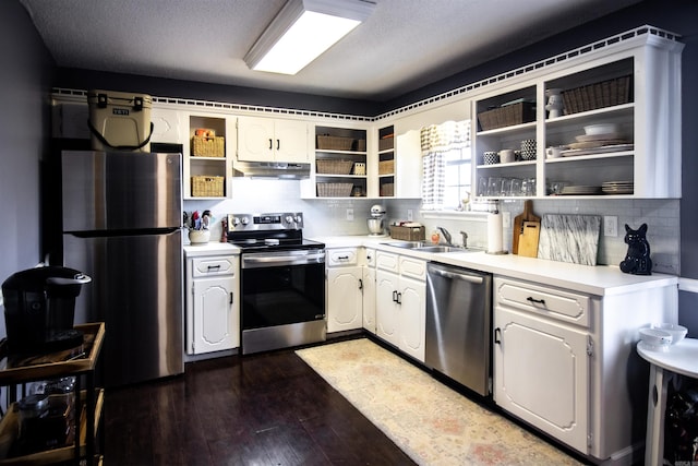 kitchen with sink, white cabinets, dark hardwood / wood-style flooring, and appliances with stainless steel finishes