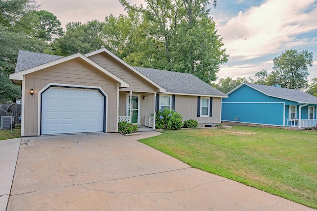 ranch-style home with a garage and a lawn