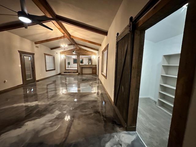 hallway with a chandelier, a barn door, and vaulted ceiling with beams