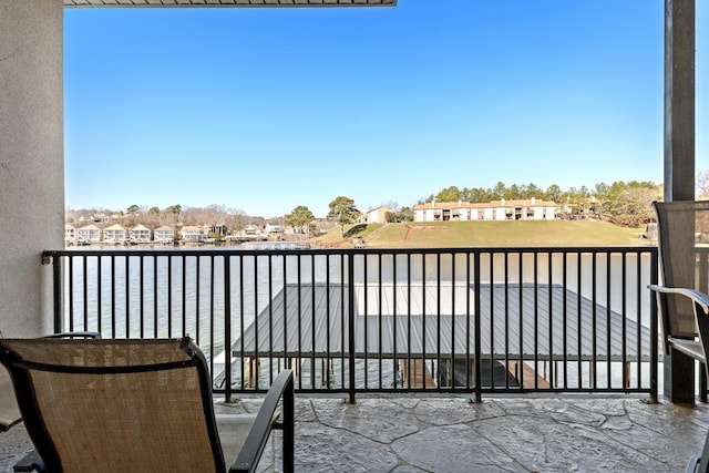 balcony featuring a water view