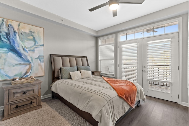 bedroom with ceiling fan, dark hardwood / wood-style floors, and access to outside