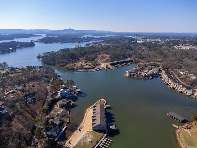 drone / aerial view with a water and mountain view