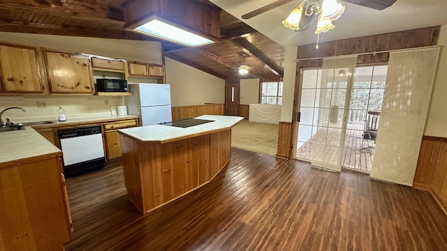 kitchen featuring vaulted ceiling with beams, wood walls, dark hardwood / wood-style flooring, and black appliances