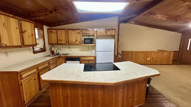 kitchen featuring sink, wood walls, a center island, lofted ceiling with beams, and black appliances