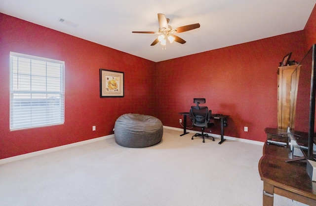 carpeted office with ceiling fan