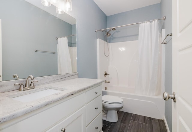 full bathroom featuring vanity, shower / tub combo, and toilet