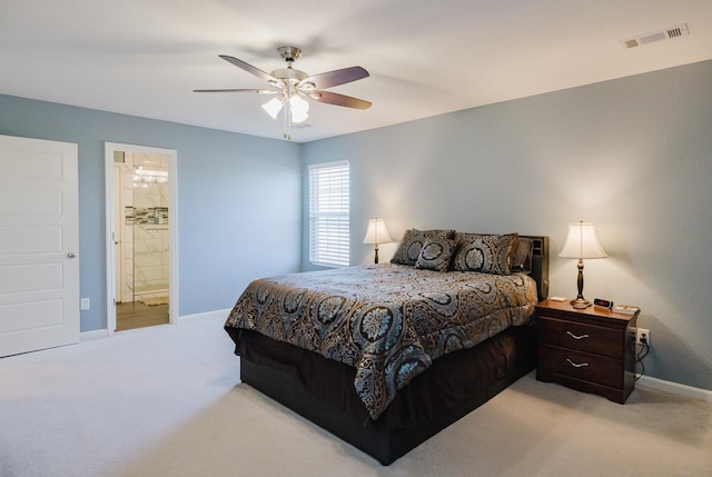 carpeted bedroom with connected bathroom and ceiling fan