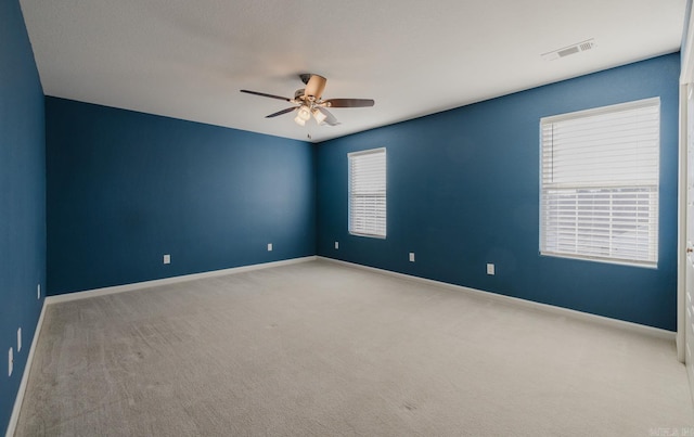 carpeted empty room with ceiling fan