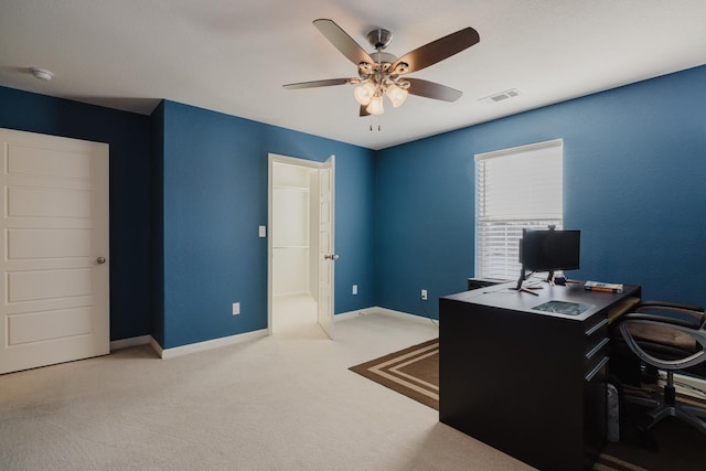 carpeted office with ceiling fan