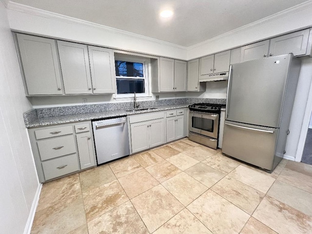 kitchen featuring gray cabinets, sink, dark stone counters, stainless steel appliances, and crown molding