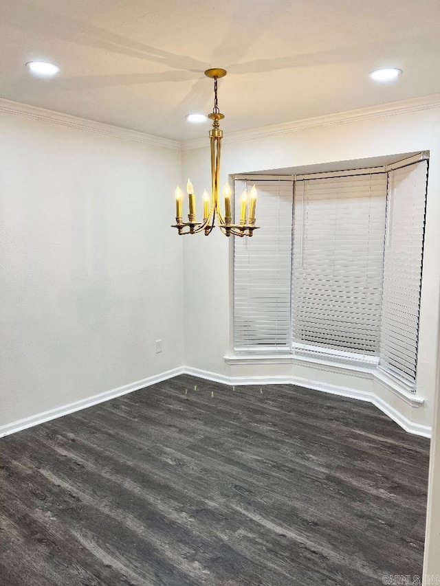 unfurnished dining area featuring crown molding, dark wood-type flooring, and a notable chandelier