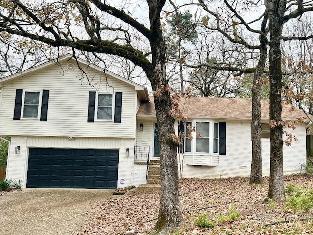 split level home featuring a garage