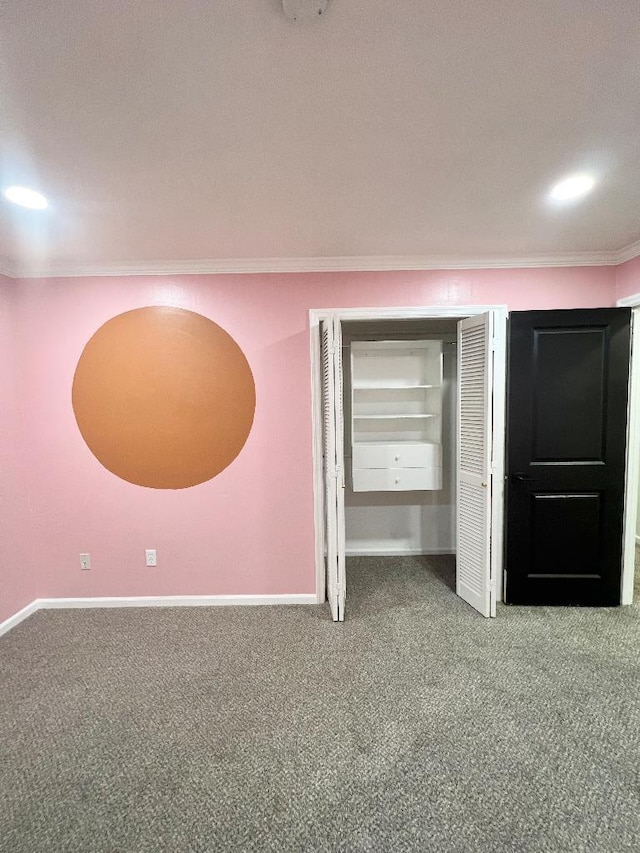 unfurnished bedroom featuring carpet floors and ornamental molding