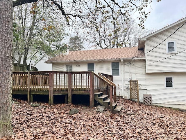 back of property with a wooden deck