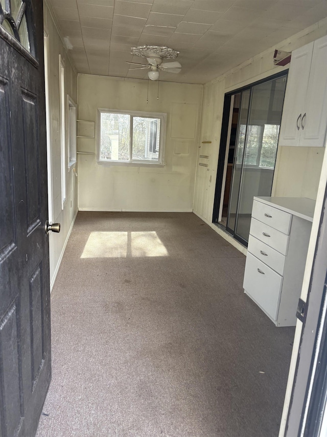 carpeted empty room with ceiling fan