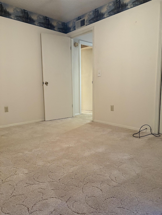 unfurnished room featuring carpet floors