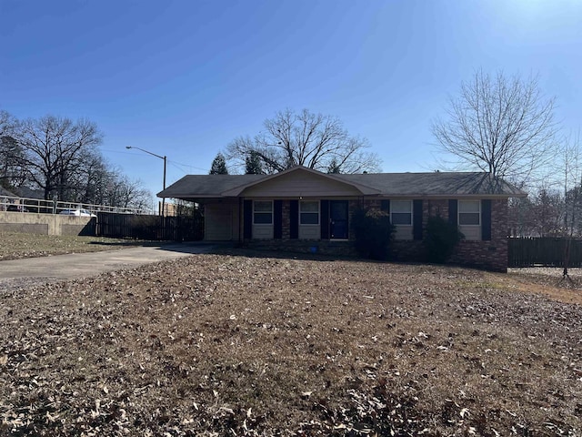 single story home with a carport