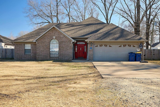 view of front facade with a garage and a front lawn